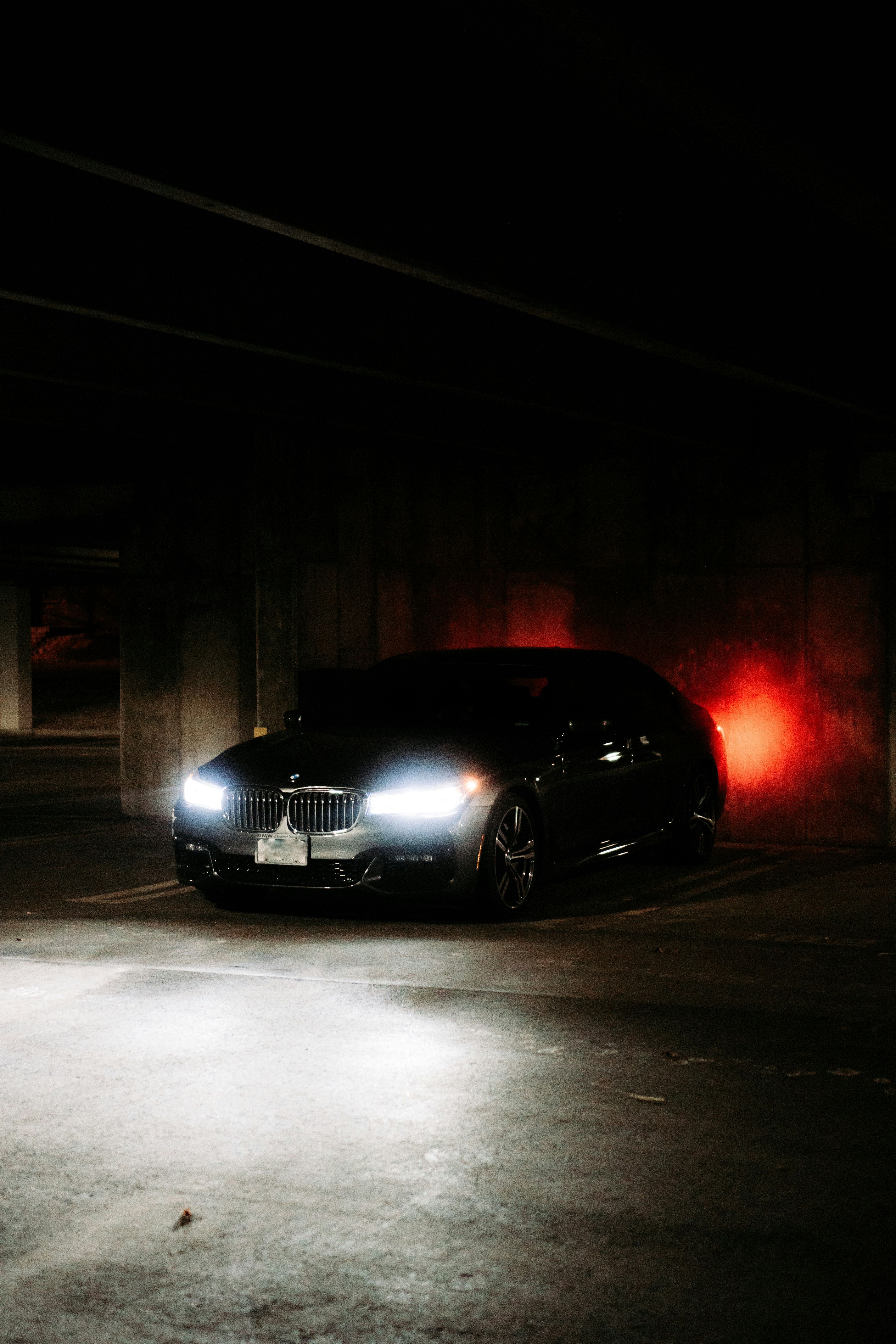 black bmw car on road during nighttime